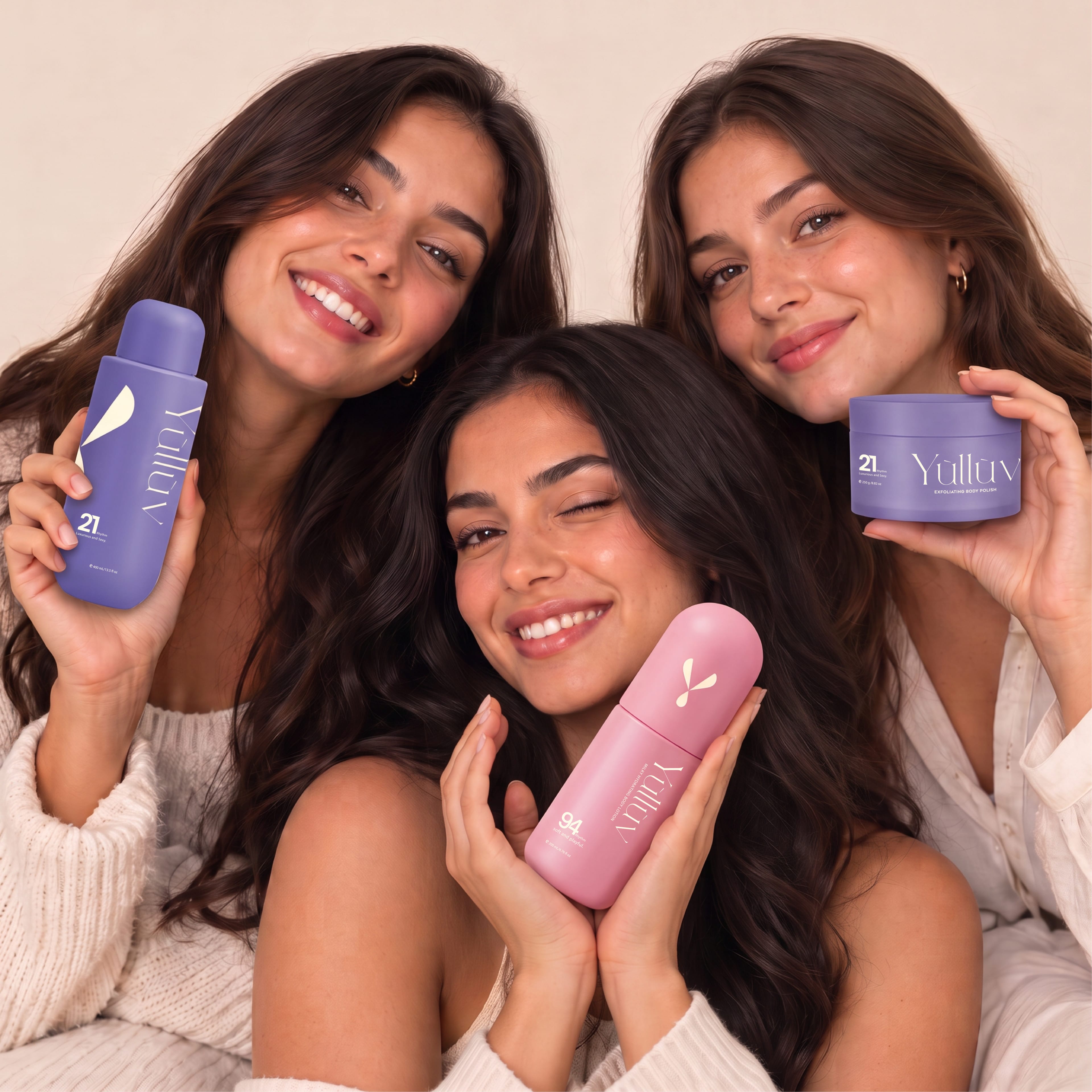 Three smiling women holding Yulluv body care